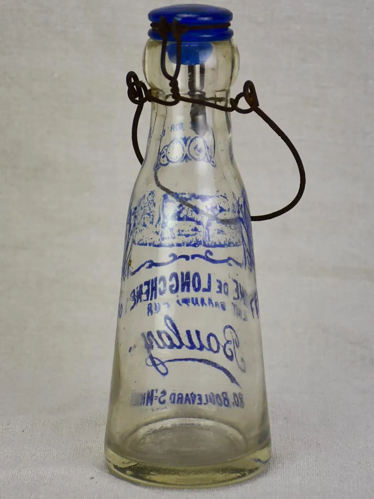 Antique French glass milk bottle with blue decoration