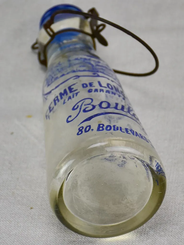 Antique French glass milk bottle with blue decoration